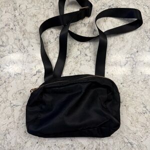 A new Day black crossbody‎ or bum handbag